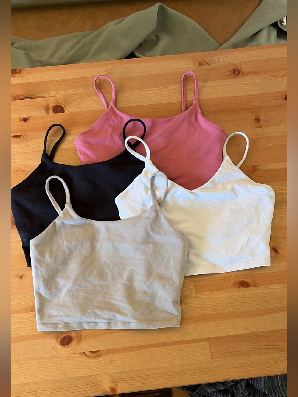 Amazon workout tops size small, no bra pads, one has two cuts in elastic